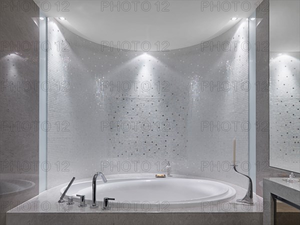 Mosaic tile above hot tub bathtub