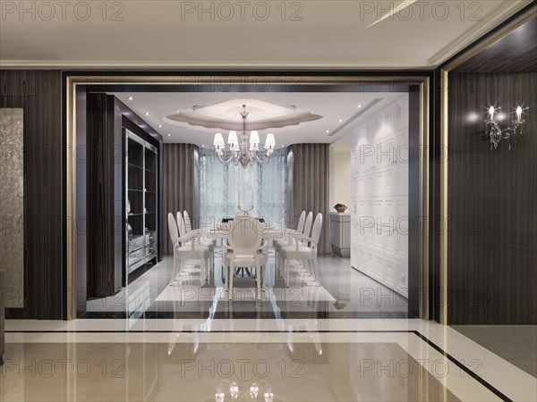 Large white dining room table in elegant modern dining room