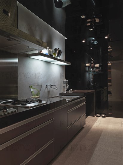 Large drawers in dark kitchen