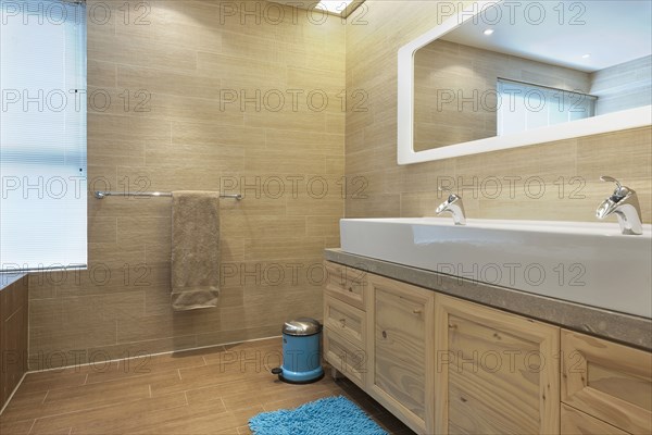 Detail of bathroom cabinets and tile floor