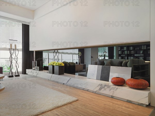 Marble ledge in living room with decorations on top