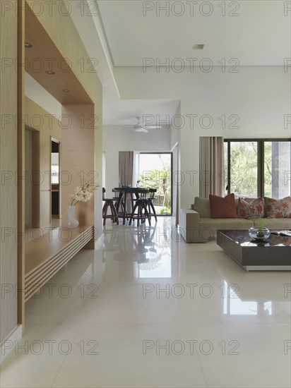 View through living room in modern home to dining area