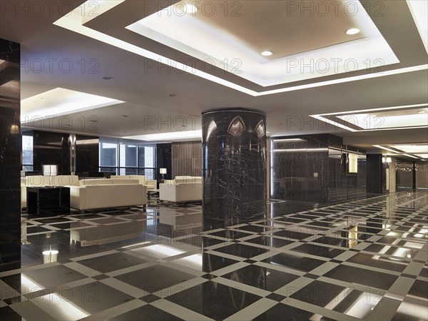 Grand foyer with patterned tile in apartment building lobby
