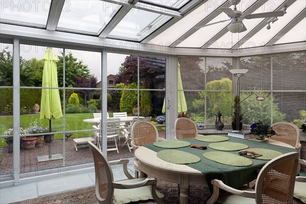 Traditional dining table in sunroom