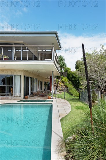 Swimming pool in front of house