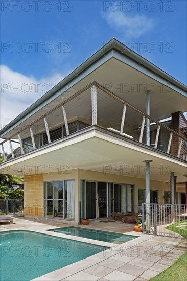 Swimming pool in front of house