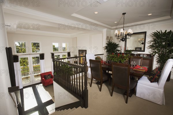 Dining area at top of steps in contemporary home