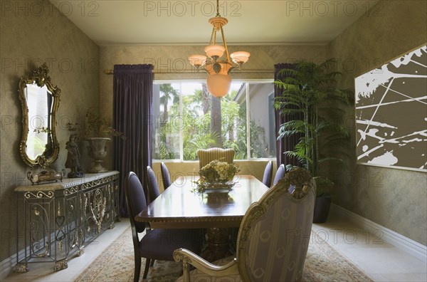 Elegant Dining Room with Purple Chairs