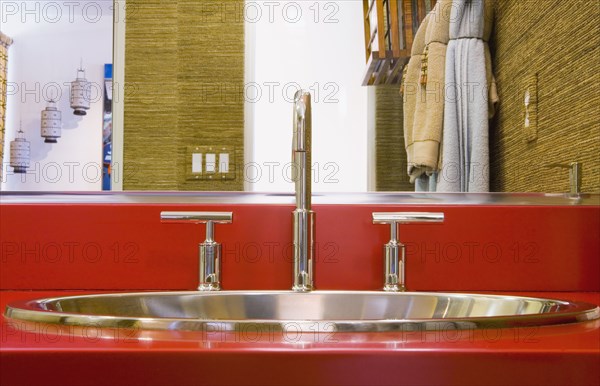 Metal Sink on Red Countertop