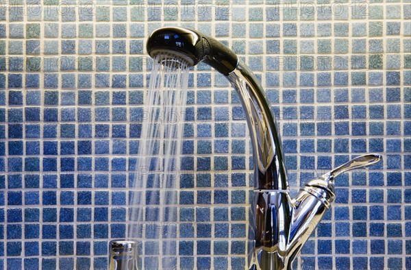 Kitchen Faucet and Blue Tiled Backsplash