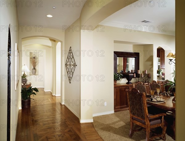 Parquet floors in hallway outside dining room