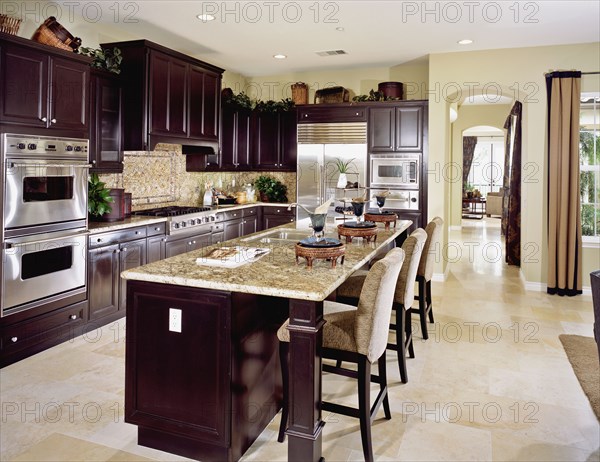 Contemporary kitchen with dark wood cabinets