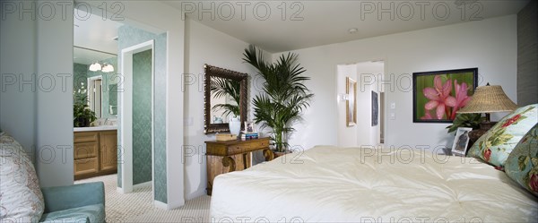 White Master bedroom and turquoise bathroom