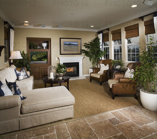 Sitting room with fireplace and television