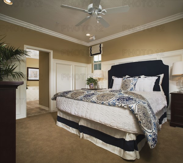 Master bedroom with wainscoting and crown molding