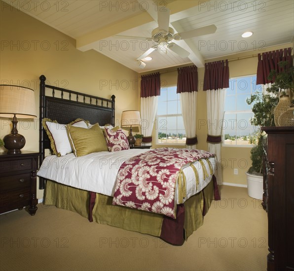 Contemporary master bedroom with wooden ceiling