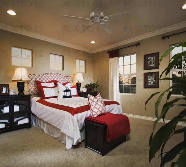 Contemporary bedroom with red and white accents