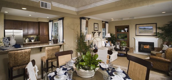 Contemporary view of kitchen living and dining areas of home