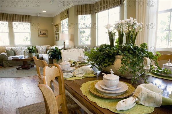 Traditional place settings on wooden dining table