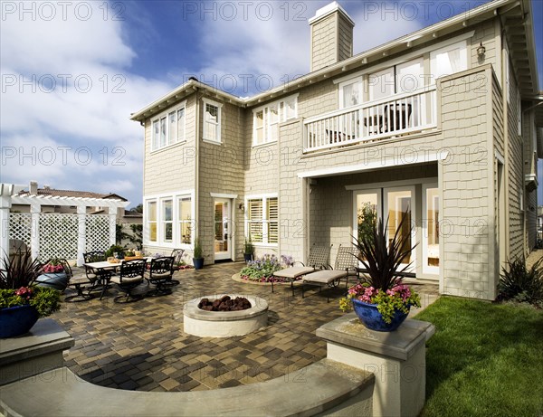 Rear exterior of residential building with seating area