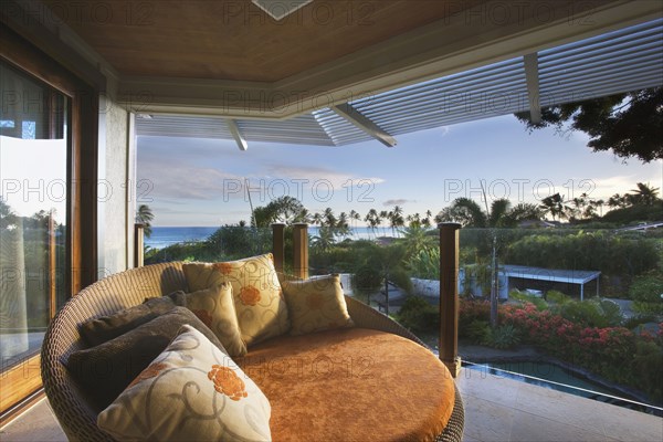 Large Round Orange Chair on Balcony