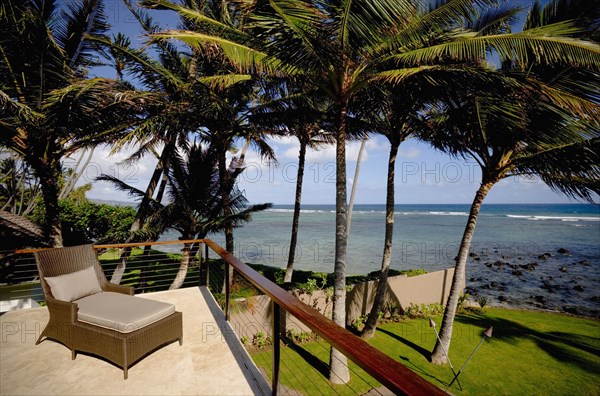 Deck Chair on Balcony Patio by Ocean