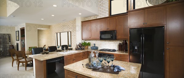 Contemporary Kitchen with Dark Wood Cabinetry