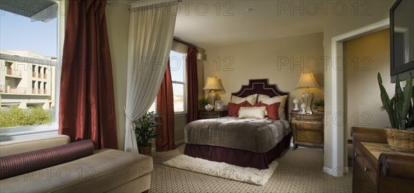 Elegant Master Bedroom with Red Accents