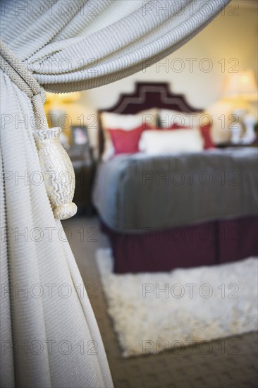 Knotted Rope and Tassels Holding White Curtain Open