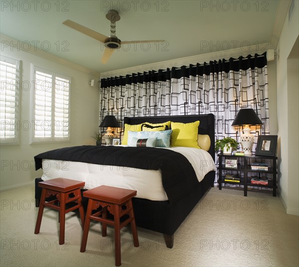 Brightly Colored Bedroom with Red Stools