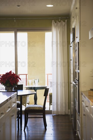 Chair at Dining Room Table with Sliding Glass Door in Background