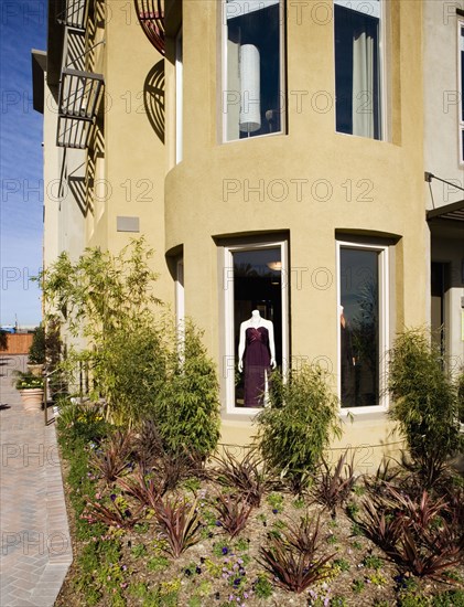 Exterior Shot of Yellow Stucco Store Front