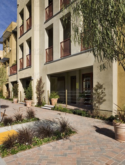 Exterior Shot of Yellow Stucco Store Front