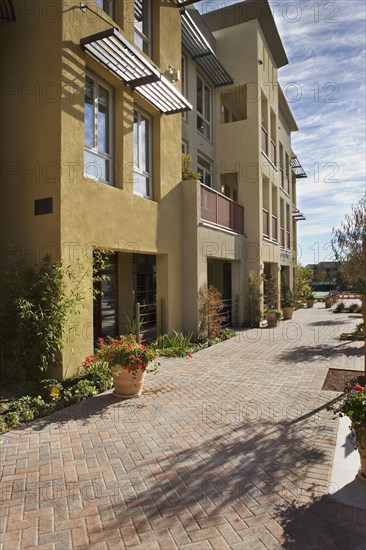 Exterior Shot of Yellow Stucco Store Front