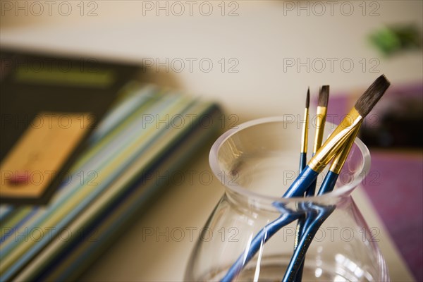 Blue Paint Brushes in Glass Jar