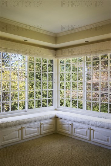 Corner window with benches and cabinets