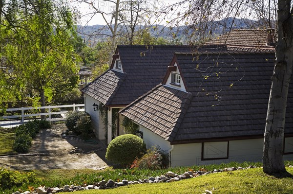 Exterior Shot of Traditional Home with Red Trim