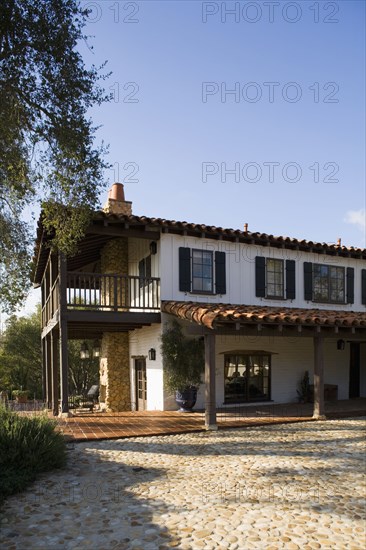 Exterior of Spanish Style Home and Landscape