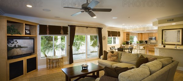 Traditional living room opening up to nook and kitchen