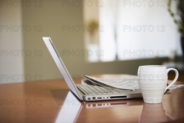 Newspaper and Laptop