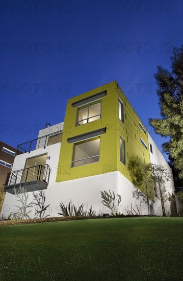 Front Exterior of Modern Condominium at Dusk