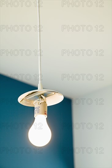 Light Bulb Hanging From White Cord