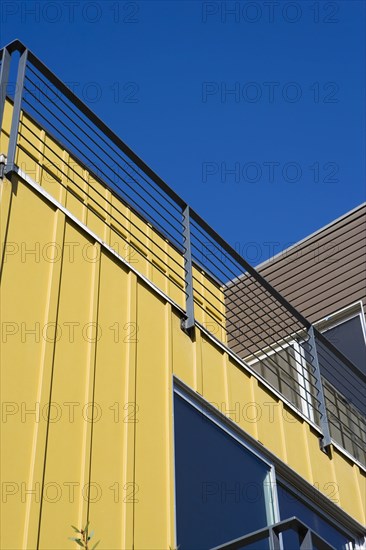 Exterior Detail of Modern Home and Balcony with Yellow Wall