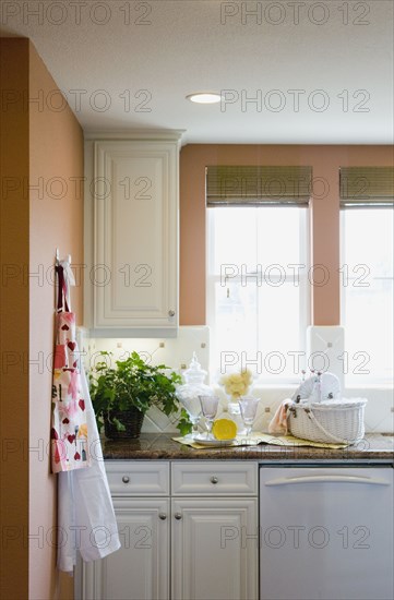 Aprons hanging on a kitchen wall