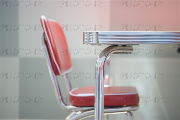 Detail of a red and chrome Retro Style children's table with chair