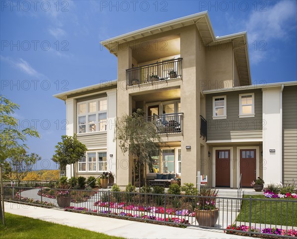 Exterior of attached homes on a sunny day