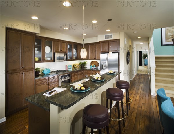 Interior of contemporary kitchen with bar