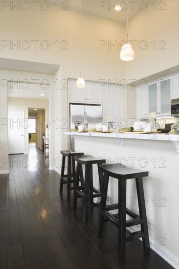 Three bar stool in a contemporary kitchen