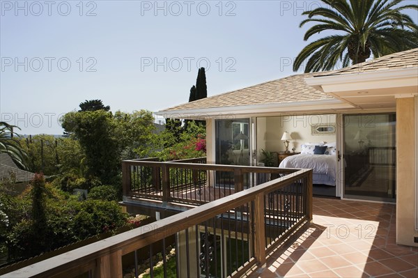 Exterior of a back patio looking into master bedroom