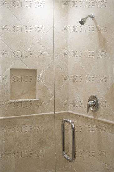Detail of stone shower with glass door